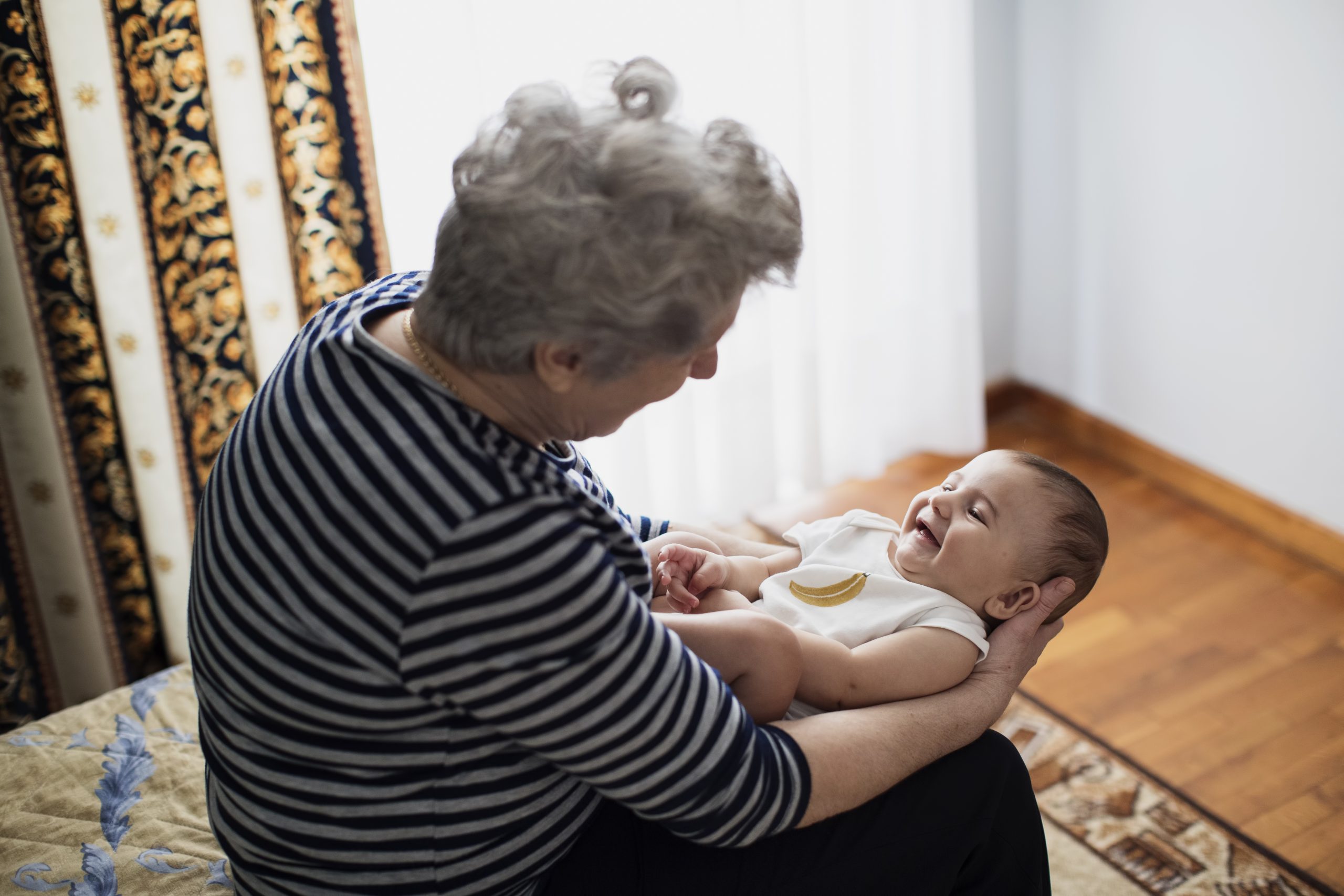 Grandmother holding her grandson